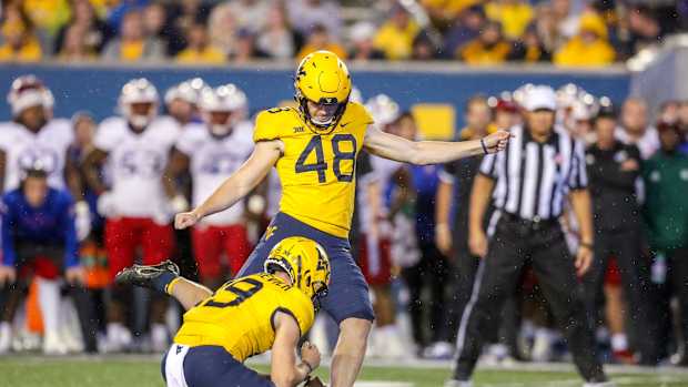 Sep 10, 2022; Morgantown, West Virginia, USA; West Virginia Mountaineers place kicker Casey Legg (48) kicks a field goal during the fourth quarter against the Kansas Jayhawks at Mountaineer Field at Milan Puskar Stadium.